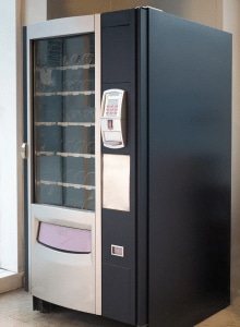 Image d'un distributeur automatique avec un design épuré.